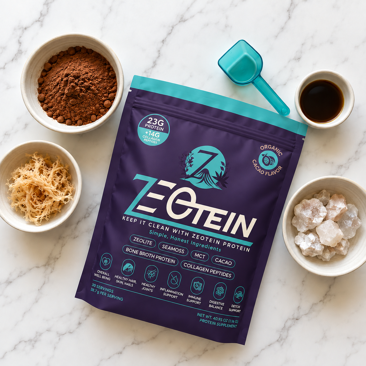 Zeotein Cacao Protein Powder surrounded by bowls of cacao powder, sea moss and zeolite with a scoop
